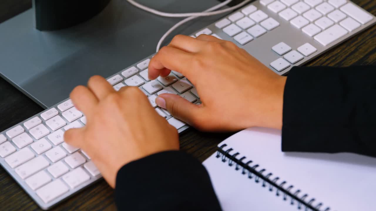 Executive working at desk in office 4k