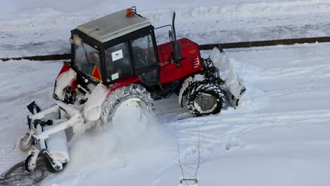 tractor removing snow from walkways