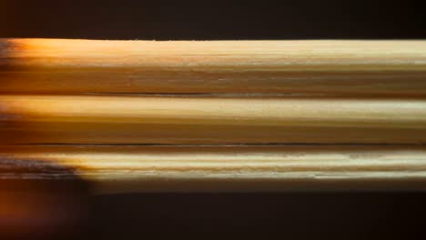 burning wooden toothpicks, sticks