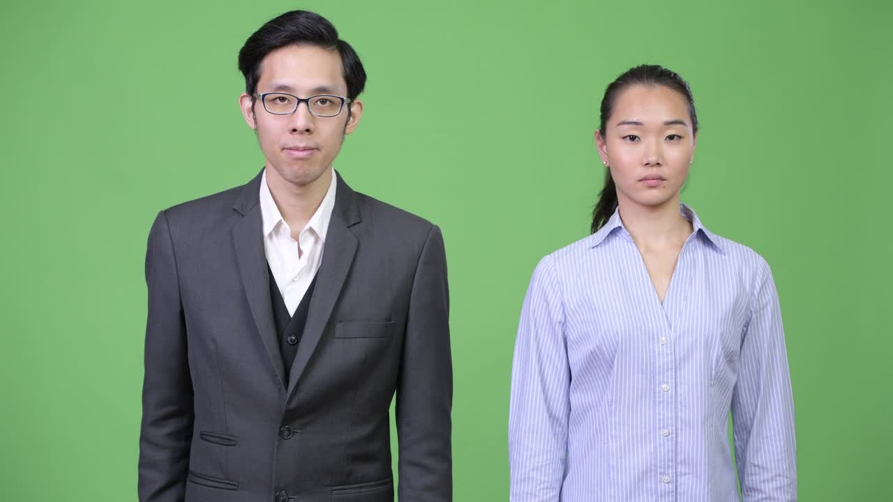 Young Asian business couple together