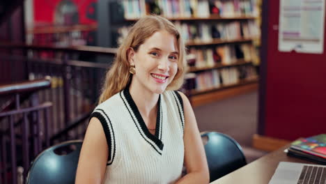 portrait of a smiling woman in a library