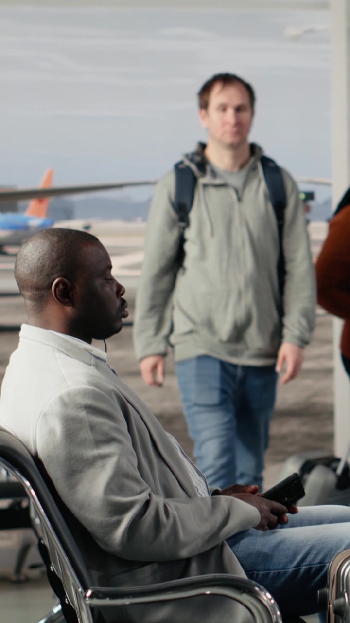 Diverse Passengers Waiting for Flight at Airport Terminal