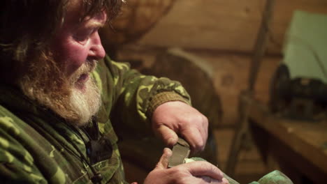 craftsman carving stone in workshop