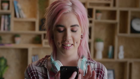 portrait-of-beautiful-punk-woman-using-smartphone-texting-browsing-online-enjoying-mobile-communication-independent-female-funky-pink-hair-slow-motion