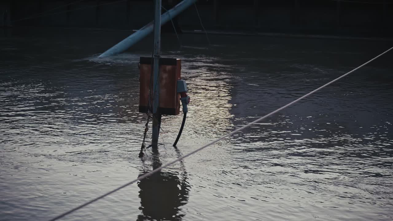 power line submerged in water during the Budapest 2024 flood, reflecting on the Danube