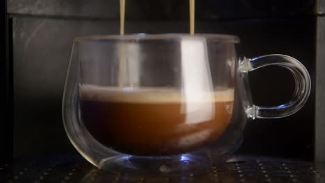 coffee machine making fresh coffee in a glass cup