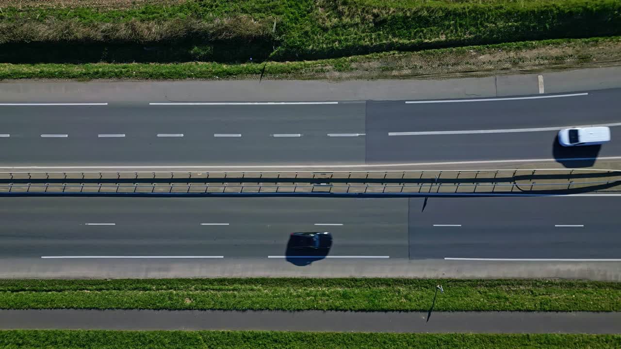Cars, driving along multi-lane highway. Aerial top-down view