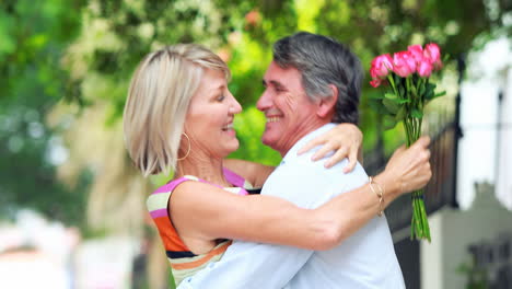 Man-giving-flowers-to-a-woman