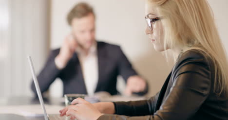 Extreme-Close-Up-Of-Business-Woman-Using-Tablet-Computer-On-A-Meeting-4