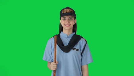 happy indian female security guard smiling green screen