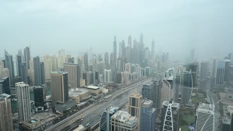 4K:-Foggy-morning-at-Dubai-Marina-District,-Dubai-skyscrapers-with-city-traffic