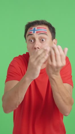 man cheering for norway, angry with the decision of referee