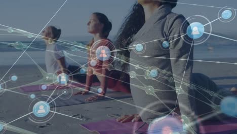 Animation-of-network-of-connections-over-diverse-women-practicing-yoga-on-beach