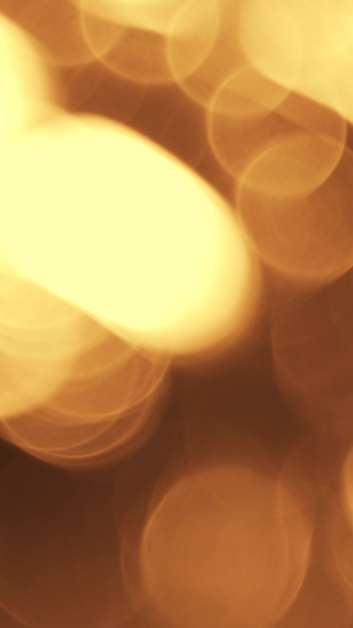 Partículas Abstratas de Bokeh de Luz Dourada Flutuando em Fundo Escuro
