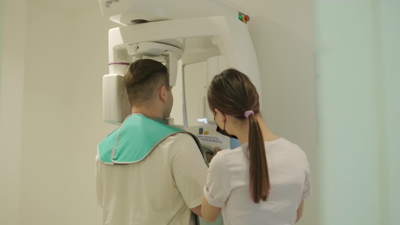 Patient Undergoing Dental X-Ray with Technician
