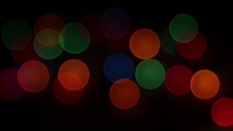 blinking defocused christmas lights in dark background