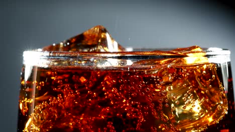 Cola-with-Ice-and-bubbles-in-glass.