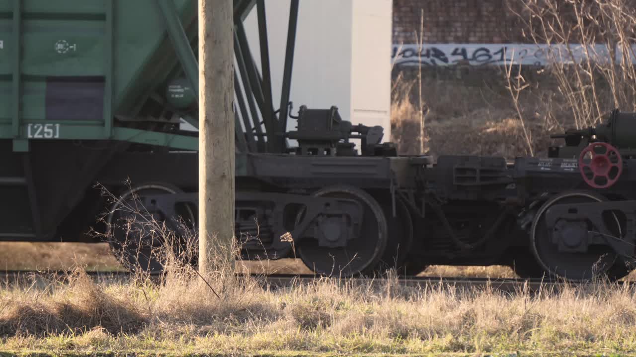 train, carrying containers, moving through the city