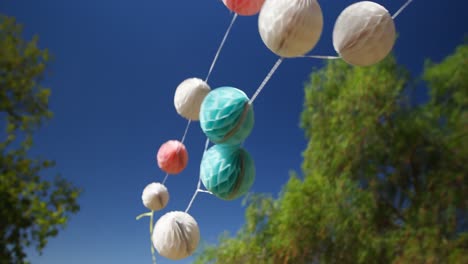 honeycomb balls waving against blue sky 4k