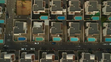 aerial view of luxury houses with swimming pools