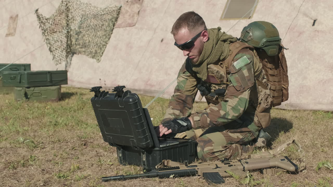 Soldier Transmitting Data Via Laptop