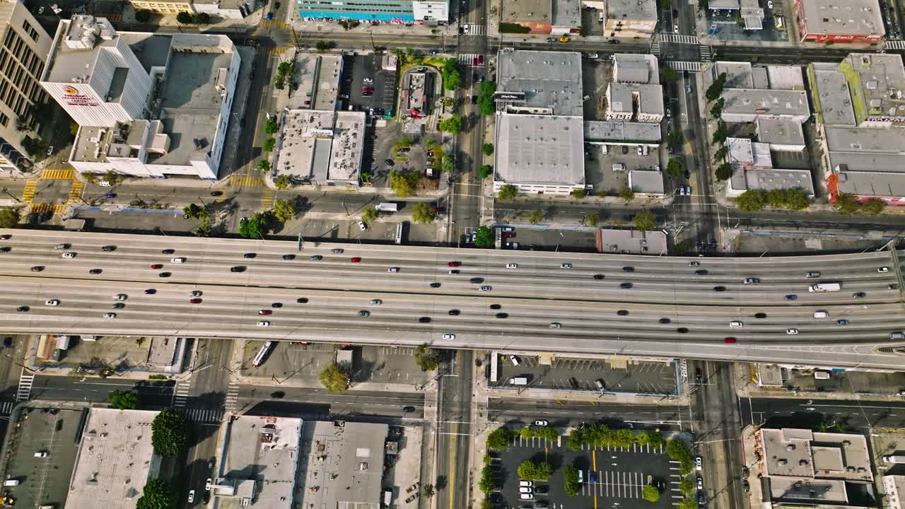 Cross street, cars, houses, mountains and freeway in Los Angeles