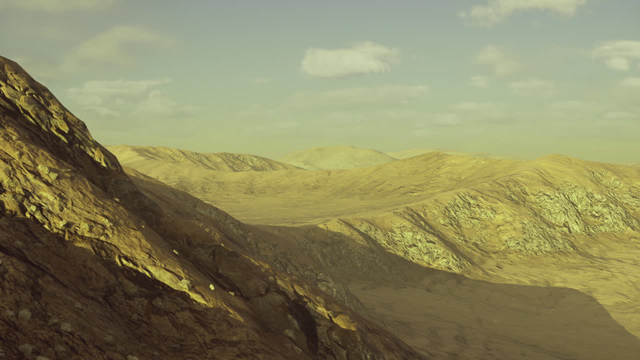 Mountain landscape showcases rugged terrain under soft sunlight