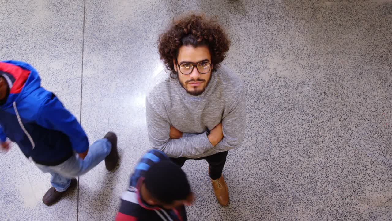 Portrait of business executive standing with arms crossed