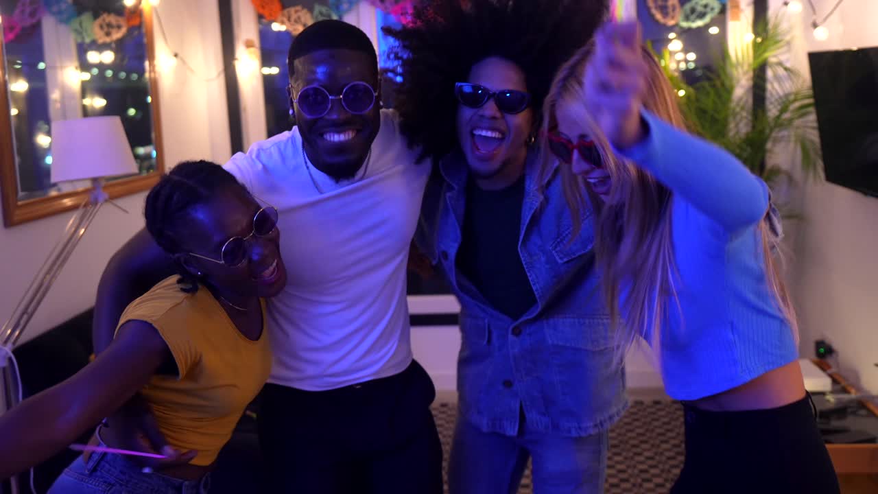 Friends Celebrating and Dancing at a Party