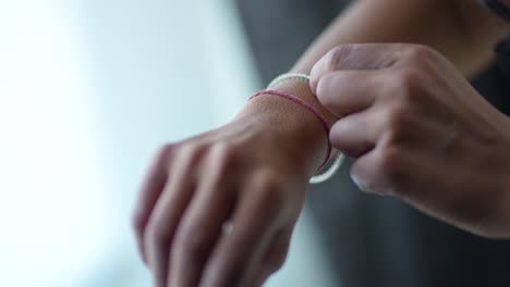 A-view-captures-a-striking-close-up-of-the-hand-of-a-lovely-bride,-adorned-with-a-bracelet