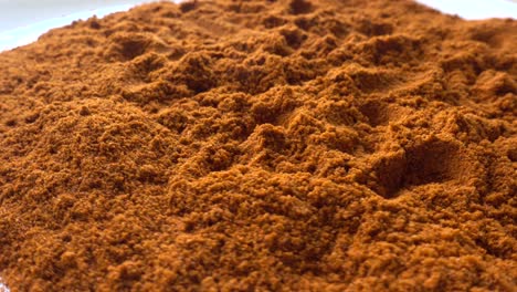 portion of paprika powder rotating