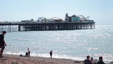 people enjoying a sunny day at brighton beach