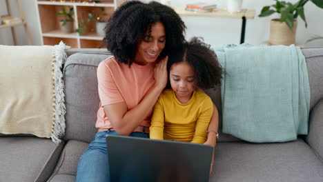 Learning,-mother-and-girl-typing-on-laptop-on-sofa