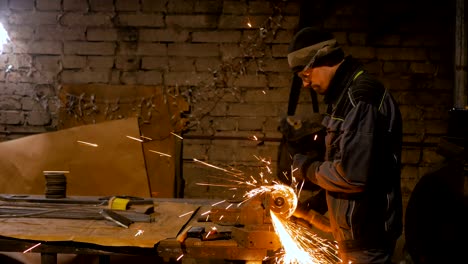 blacksmith sawing metal with hand circular saw