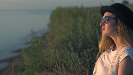 woman at sunset by the river
