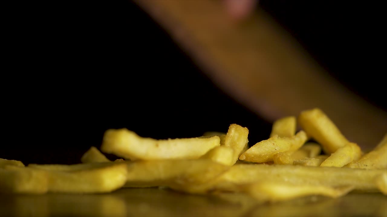Hand picking French Fries