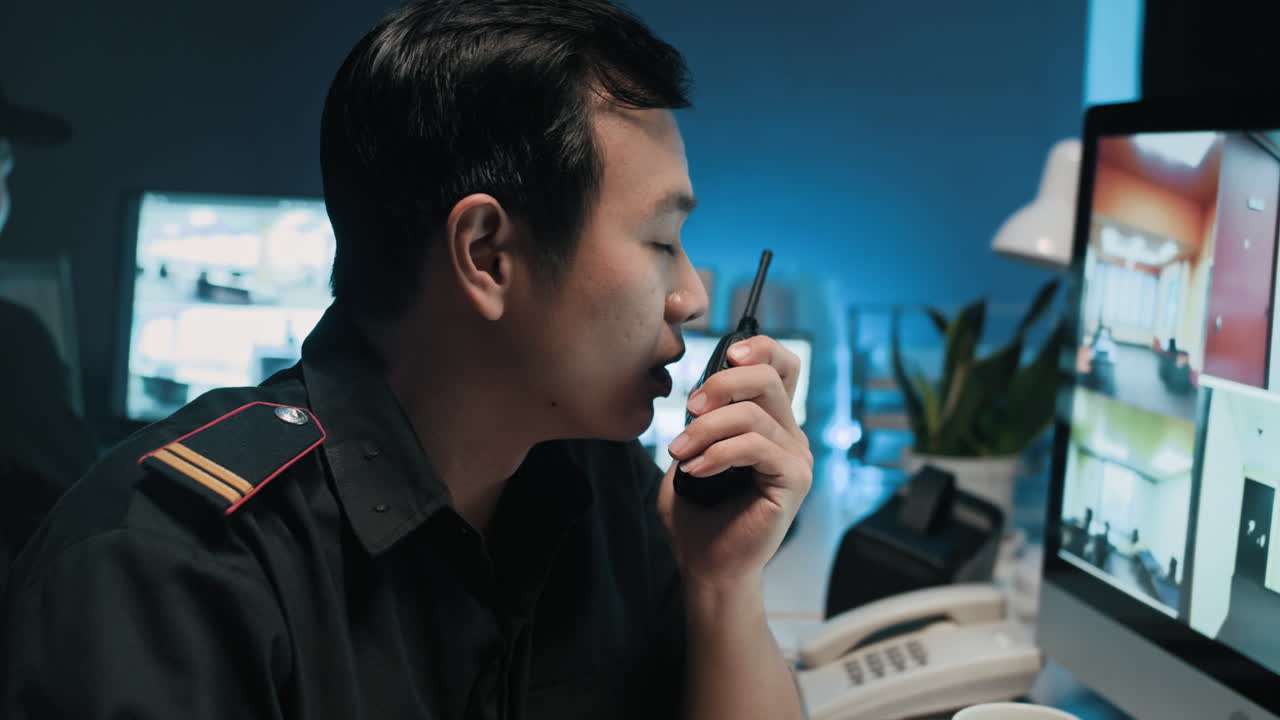 Surveillance Manager Transmitting Data via Walkie-talkie