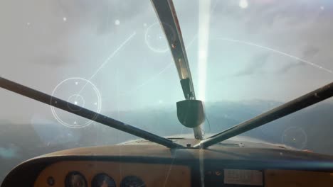 glowing network of connections against front view of dashboard of private aircraft