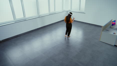 woman using vr headset in modern office