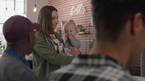 business people meeting team leader woman mother holding baby discussing corporate project with colleagues multitasking in modern office workplace