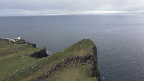 Aerial-view-of-Neist-Point-encapsulating-the-untamed-beauty-of-the-Scottish-coastline,-where-nature's-forces-have-sculpted-a-rugged-masterpiece-that-is-both-awe-inspiring-and-serene