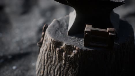 old anvil attached to a stump