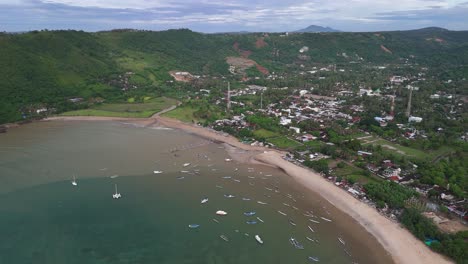 Flyover shallow sandy ocean bay at Kuta Beach at Baturiti, Lombok