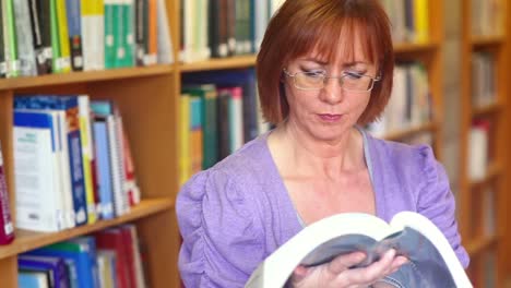 serious librarian reading a book