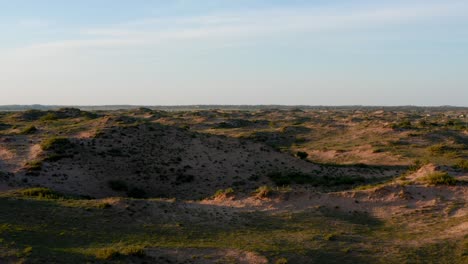 barren dry arid red dirt landscape grassland and blue sky in mongolia, drone push in