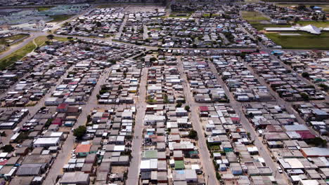 Layout-of-Zwelihle-township-in-Hermanus,-South-Africa,-drone-tilt-up