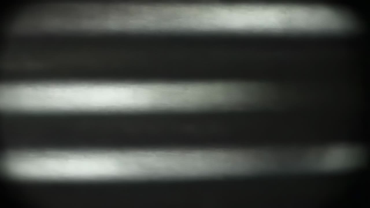 Starting with streaks flickering on dark screen, bands shifting and simulating analog interference