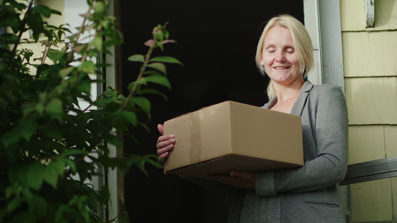 Happy Woman Holding Parcel