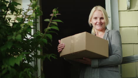 happy woman holding parcel