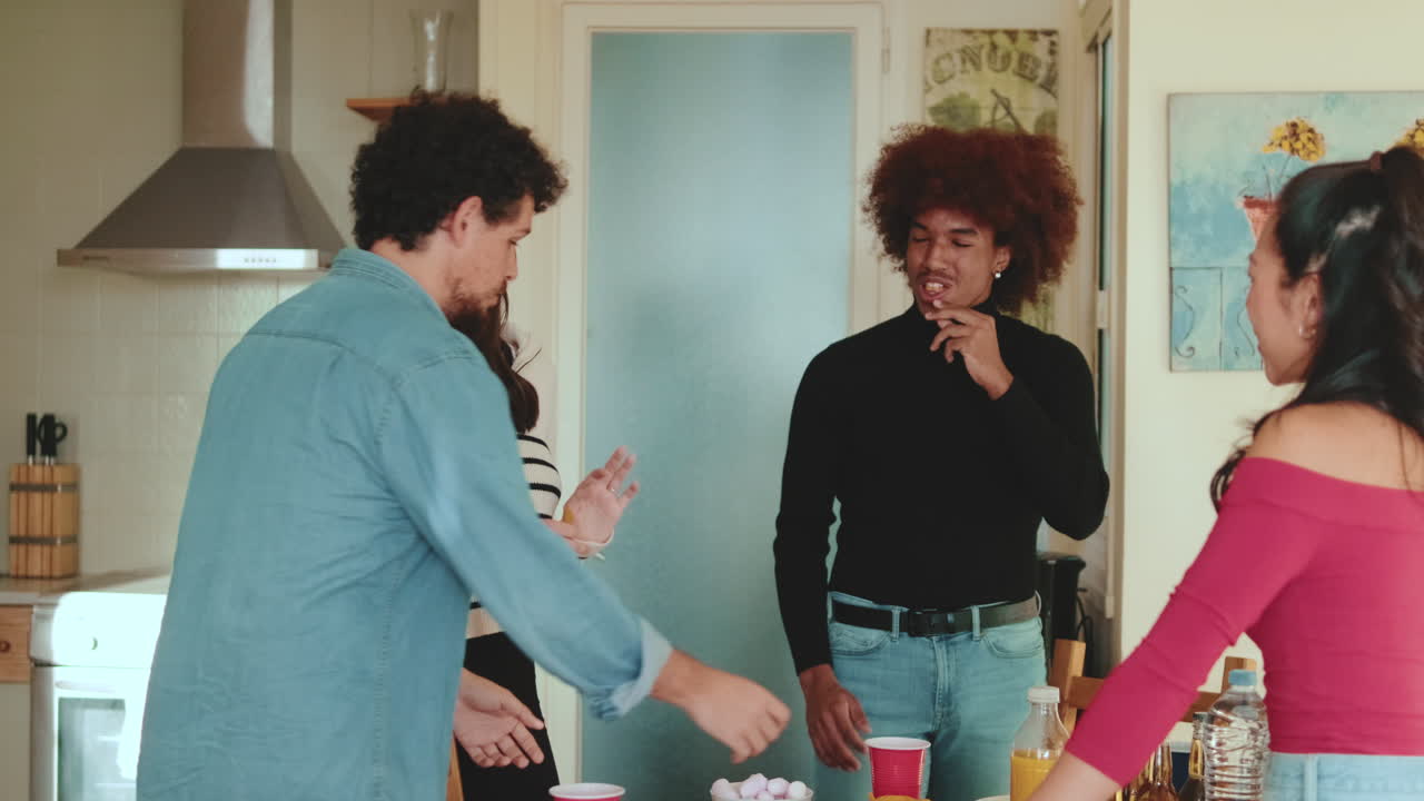Group of friends enjoying a social gathering with snacks